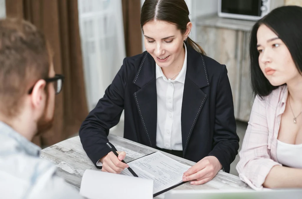 Two-female-and-a-male-doing-insurance-paperworks