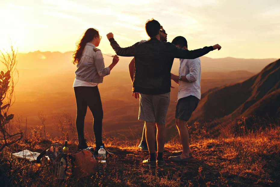 young-people-enjoying-life-on-the-mountain-during-sunset
